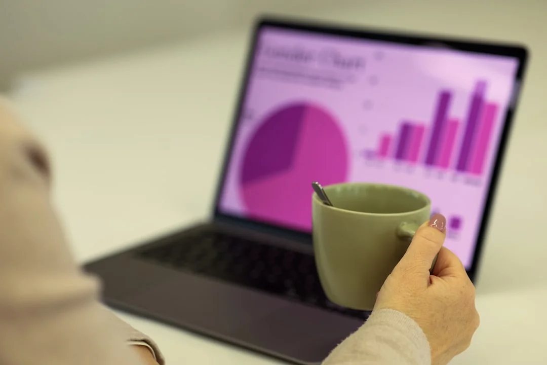 A professional meeting in a café with a laptop presenting an SEO strategy. Perfect for business ideas.